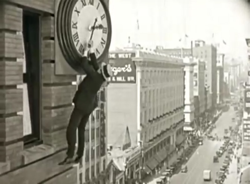 Actor Harold Lloyd hanging from a giant clock in the 1923 film Safety Last! This scene is referenced twice in Back to the Future. Once briefly in the cold open, and again at the climax of the film.