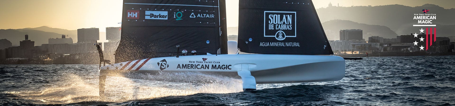American Magic boat racing in the water.