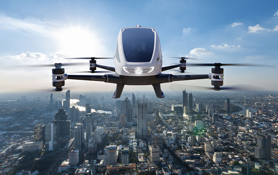 3D rendering of a drone flying safely on a sunny day over a city demonstrating an extended battery range.