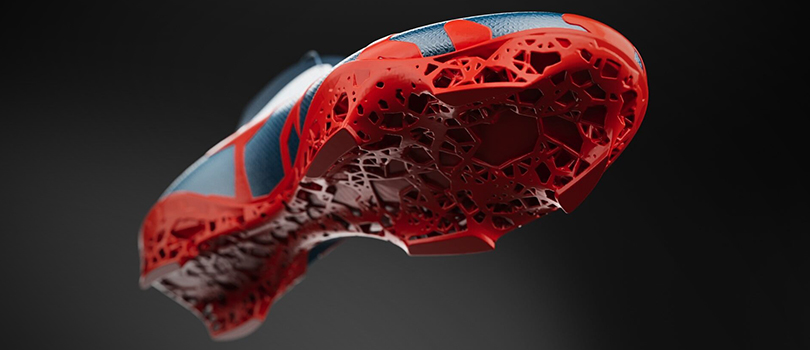 A 3D render of a topology optimized soccer cleat, showing sole and foot support.