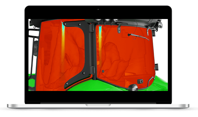 Computer screen displays a heat-flow simulation of a tractor cabin, shown in red, that was generated with a romAI reduced order model.