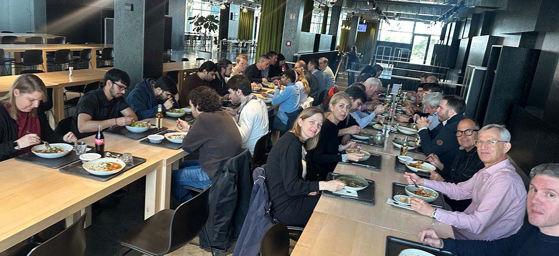Germany office enjoying lunch in a cafeteria.